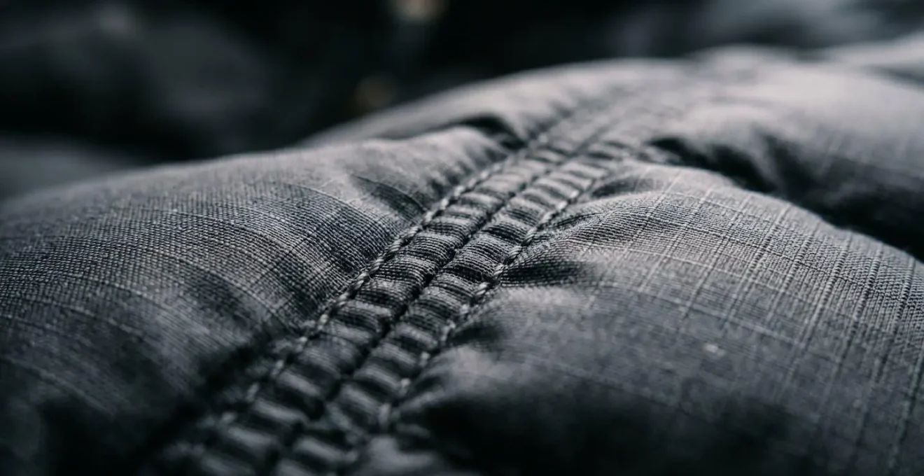 Macro shot of premium down jacket material and stitching details
